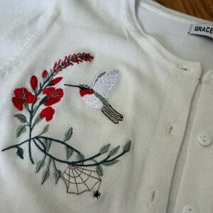 Spiderweb and Hummingingbird White Cardigan with Red Floral Embroidery